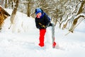 A young boy in the village cleans the snow and makes a walk Royalty Free Stock Photo
