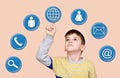 Young boy touching globe button on a virtual touch screen Royalty Free Stock Photo
