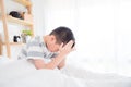 Young boy wake up with headache in the morning
