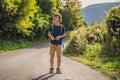 Young boy walking on a hiking pathway in a wood