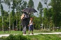 Young boy walking in a village road with his mother unique photo