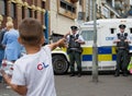 Young boy waving at the friendly police in Northern Ireland PSNI