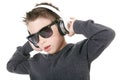 Young boy wearing headphones listening music in Royalty Free Stock Photo