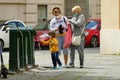 Young boy wearing protective mask can now meet again his granmother in Phase 2 after lockdown for Coronavirus pandemic Royalty Free Stock Photo