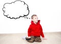 Young boy wearing red hoodie is daydreaming thinking about something, text cloud with space for your text Royalty Free Stock Photo