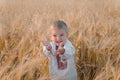 Young boy wearing traditional ukraine clothes in wheat