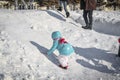 Young boy wears light blue coat He plays snow in Harbin/China