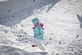 Young boy wears light blue coat He plays snow in Harbin/China