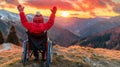 Young boy in wheelchair enjoys sunset, raises arms joyfully with mountains in the background