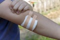 Young boy with white cotton dressing bandage on his elbow