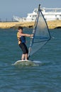 Young boy windsurfing and having fun