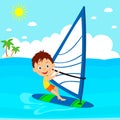 Young boy windsurfing in the sea