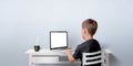 Young boy working on the laptop computer. Notebook with  display for web page promotion Royalty Free Stock Photo