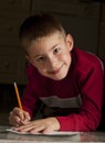 Young boy writing