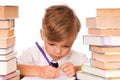 Young boy writing and books Royalty Free Stock Photo