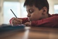 Young boy writing homework Royalty Free Stock Photo