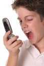 Young boy yelling into cellphone Royalty Free Stock Photo