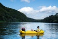 Young boy on yellow packraft boat