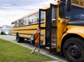 Young boy and yellow school bus