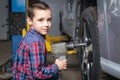 A young boy, a young auto worker