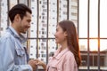 Young boyfriend and girlfriend couple holding hands in a romantic dating relationship. Asian teenager woman and man happy smiling Royalty Free Stock Photo