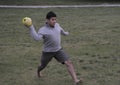 Young boy plays soccer in a neighborhood game Royalty Free Stock Photo