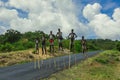 Young Boys of Benna Tribe with Traditional Body Painting on the Long Wooden Sticks posing for the picture Royalty Free Stock Photo