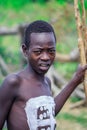 Young Boys of Benna Tribe with Traditional Body Painting on the Long Wooden Sticks posing for the picture Royalty Free Stock Photo