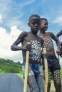 Young Boys of Benna Tribe with Traditional Body Painting on the Long Wooden Sticks posing for the picture Royalty Free Stock Photo