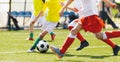 Young Boys Compete in Tournament Match in a Duel. Football Game on Summer Sunny Day Royalty Free Stock Photo