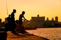 Young boys fishing at sunset in Havana Royalty Free Stock Photo