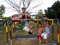 Young boys and girls playing at a playground in Antipolo City, Philippines