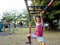 Young boys and girls playing at a playground in Antipolo City, Philippines