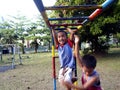 Young boys and girls playing at a playground in Antipolo City, Philippines