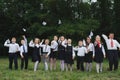 Young boys and girls in uniform outdoors