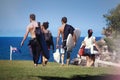 Young boys and girls walking with surfboard toward Bronte Beach in Sydney, Australia