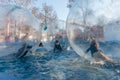 Unidentified children play having fun inside large tarsparent balls on the water