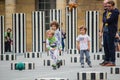 Young boys play soccer amidst the Colonnes de Buren, Palais Royal, Paris