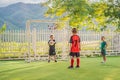 Young boys playing football soccer game. Running players in uniforms Royalty Free Stock Photo