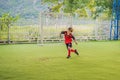 Young boys playing football soccer game. Running players in uniforms Royalty Free Stock Photo