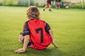 Young boys playing football soccer game. Running players in uniforms Royalty Free Stock Photo