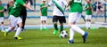 Young Boys Playing Soccer Football Match on Pitch. Kids Running with Ball