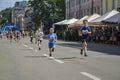 Young boys racing on the city street during the children running competition Royalty Free Stock Photo