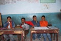 Young boys sitting on their disks at school in Egypt Royalty Free Stock Photo