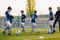 Young Boys in Sports Club on Soccer Football Training. Kids Enhance Soccer Skills on Natural Turf Grass Pitch