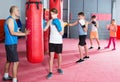 Young boys sportsmans at boxing workout