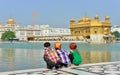 Young Boys Squatting in Golden Temple, Amritsar Royalty Free Stock Photo