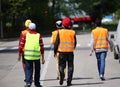 young boys with turbans and the high visibility jackets walking Royalty Free Stock Photo