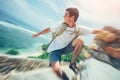 Young brave man hanging above the ocean Royalty Free Stock Photo
