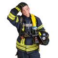 Man in uniform of firefighter holds hardhat and fire hose Royalty Free Stock Photo